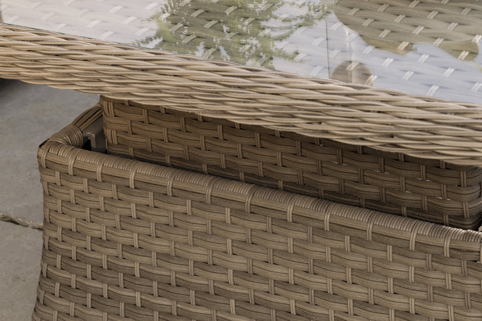 Close‑up of the Charlbury Signature Corner Set showing the detailed multi‑weave rattan and glass‑top table.