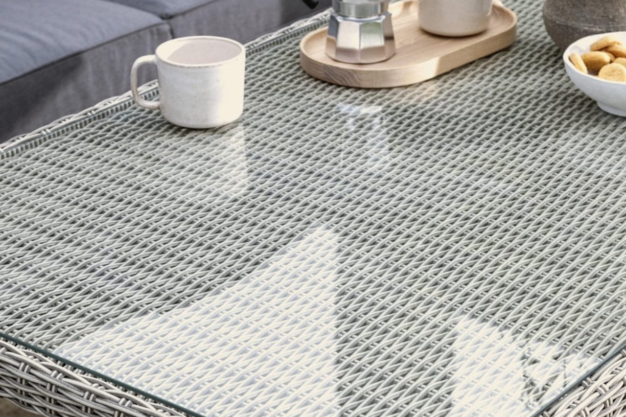 Close up of Kettler Palma glass table top with mug