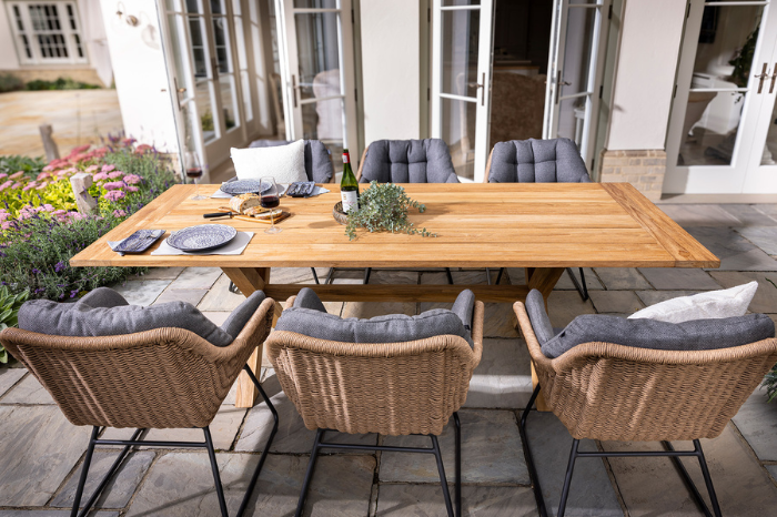 6 seat rectangular garden dining set with solid teak table and cushioned chairs