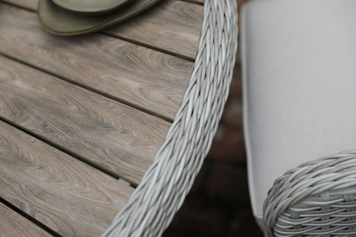 Close-up of Hemsby dining chair weave detailing and polywood tabletop