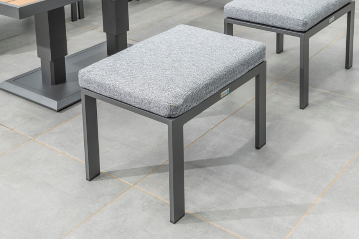 Close-up of the grey cushioned stool from the Norfolk Leisure Sutton Mini Corner Set showing aluminium frame and deep seat cushion.