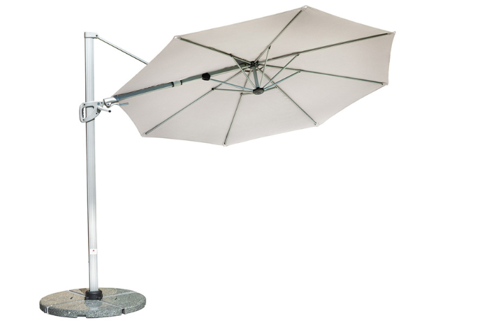 Beige patio umbrella with a stone base on a white background
