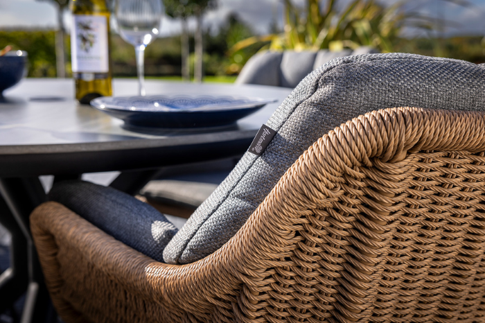 Detail of hand-woven tawny resin rattan dining chair with Rhino cushion