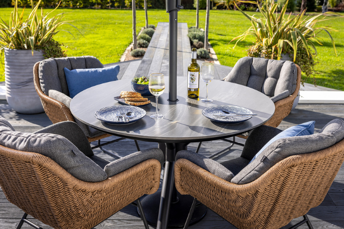 Close-up of Hartman Rayo lava ceramic tabletop on round outdoor dining table