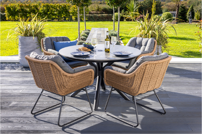 Contemporary 4 seat outdoor dining set with round ceramic table and cushioned chairs