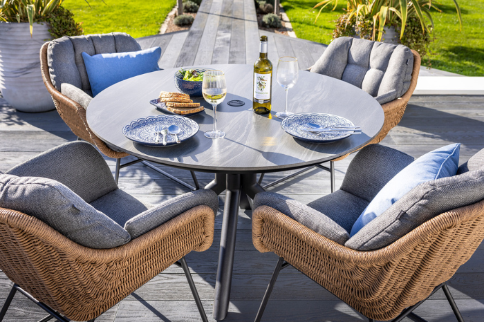 Round garden dining table with adjustable feet on patio surface