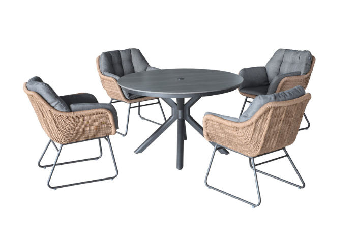 Rayo outdoor table with four wicker chairs on a white background