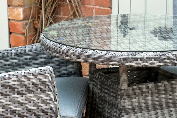 Round bistro table with clear tempered glass top from the Supremo Tivoli reclining bistro set